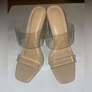 Nude heels with clear straps and heel